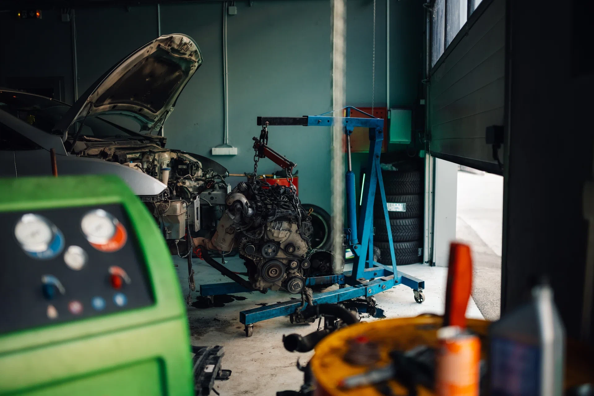 Open car hood with engine and tools laid out — same transparency we bring to every estimate